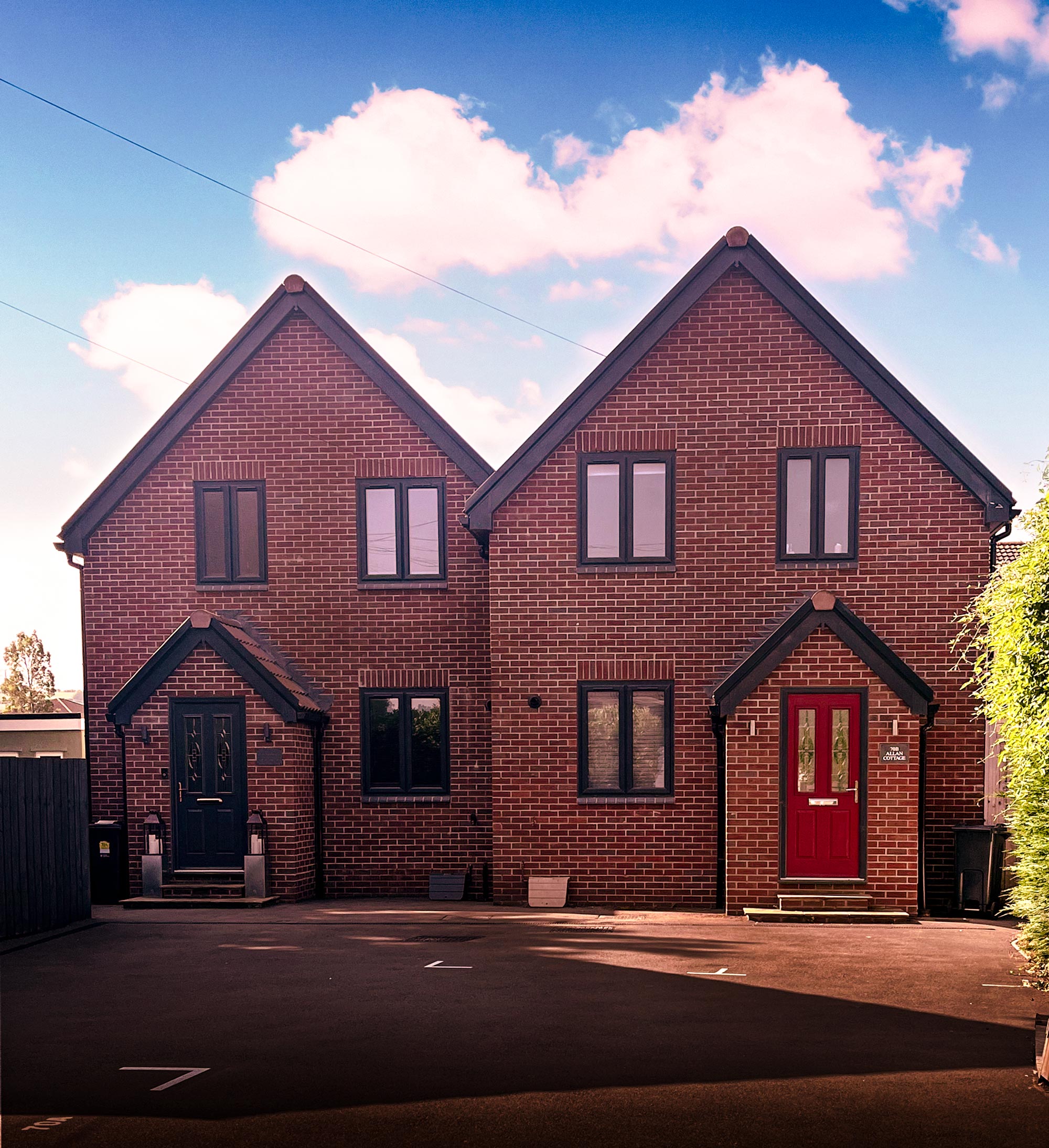 Street view of the front of two new houses at Bristol Road, Portishead, project managed by Foley Allan in Bristol
